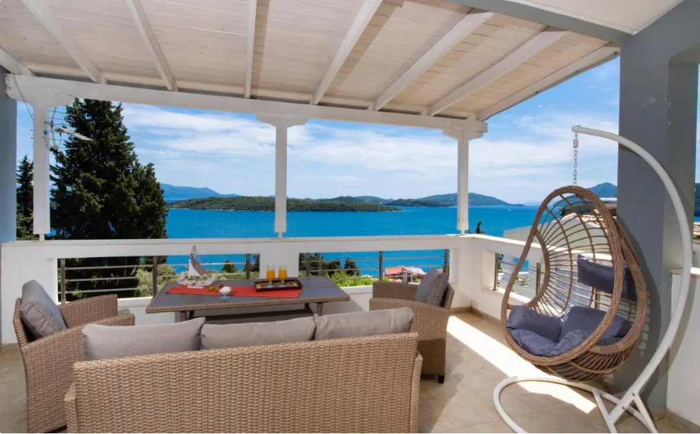 Bedroom opening to the terrace and sea view